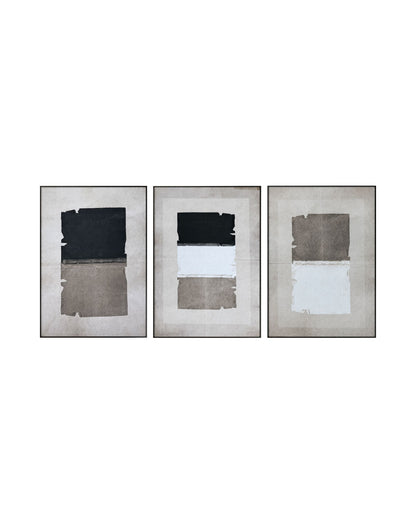 Set of three abstract art pieces with black, charcoal, and beige geometric blocks on a cream background