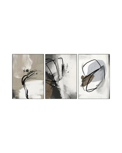 Modern minimalist abstract triptych wall art featuring organic watercolor splashes, textured neutral blocks, fluid black ink linework, and speckle splatters in beige, grey, taupe, and brown with slim charcoal frames.