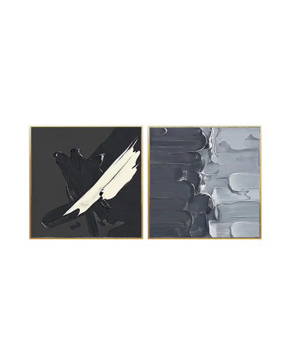 Modern minimalist abstract diptych wall art featuring heavy impasto palette knife brushstrokes in textured charcoal gray, black, and white with gold frames.